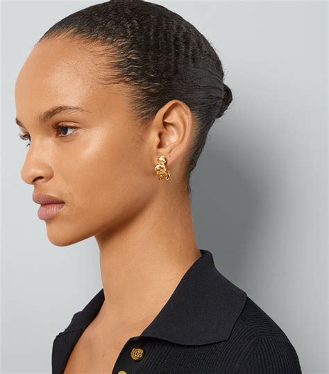 gucci interlocking earrings on ear|Gucci double g hoop earrings.